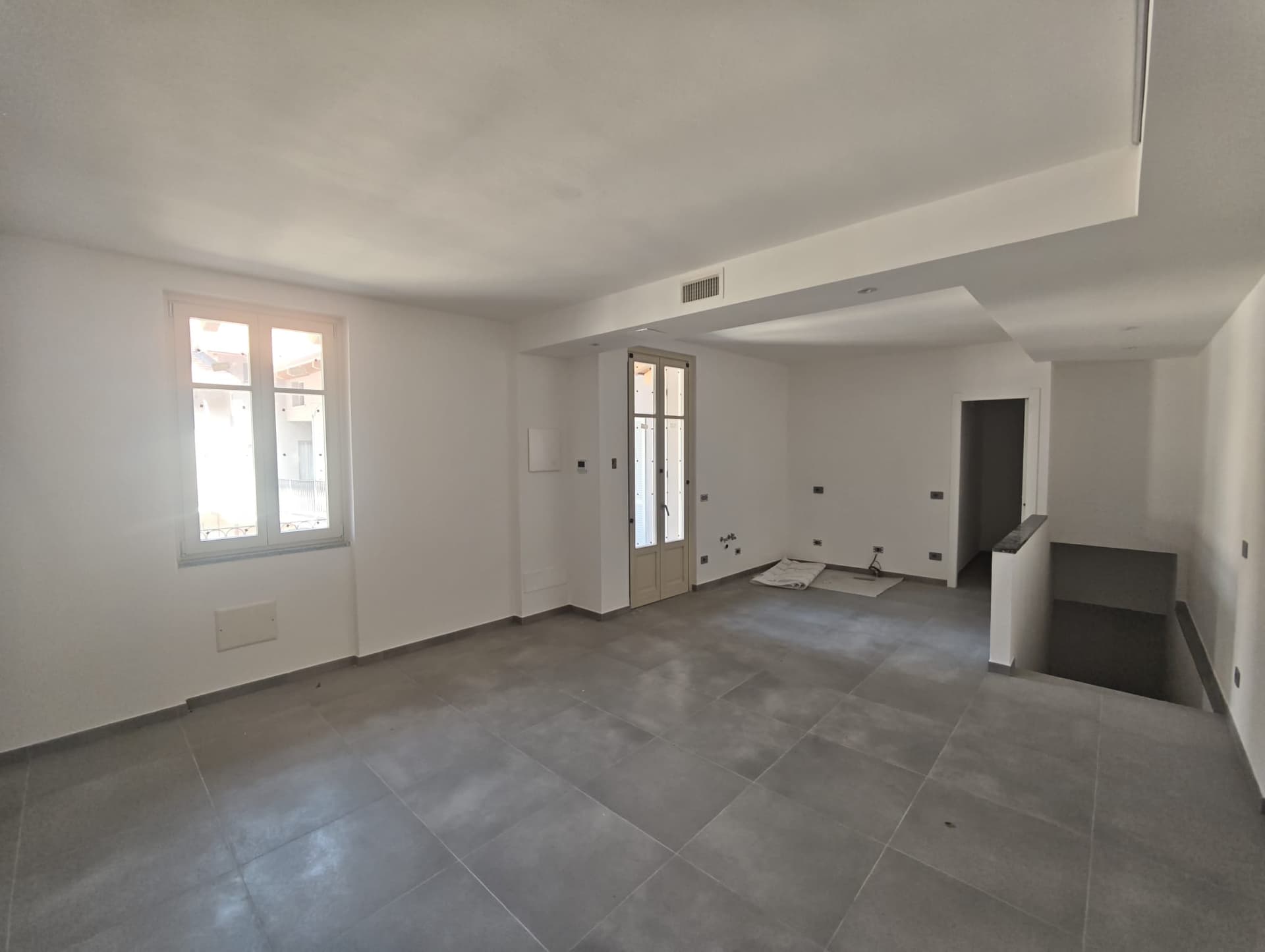 Foto reale della zona giorno dell'appartamento 9